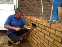 Electrical supervisor paul installing brick lighting on a conservatory in Stevenage.