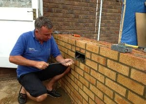 Electrical supervisor paul installing brick lighting on a conservatory in Stevenage.